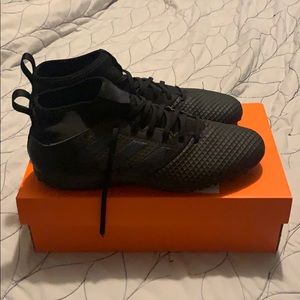 Black Adi-Zero turf soccer shoes